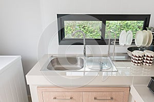 modern kitchen room with sink on counter