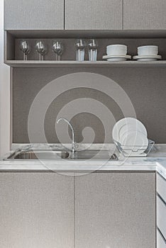 modern kitchen room with sink on granite counter top