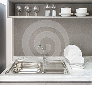 modern kitchen room with sink on granite counter top