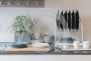 modern kitchen room with sink on top granite counter