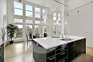 Modern kitchen with two story windows