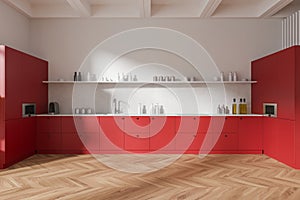 Modern kitchen with vibrant red cabinets, sleek countertops, and herringbone wood flooring on a plain background illustrating home
