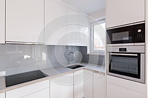 Modern kitchen with white cupboards photo