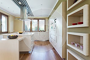 Modern kitchen with white fitted cabinets