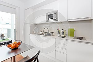 Modern kitchen with white furniture