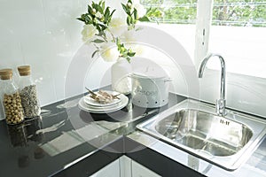 Modern kitchen with white worktop sink