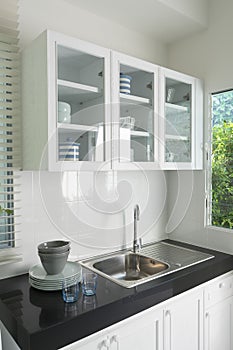 Modern kitchen with white worktop sink