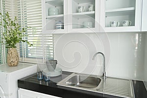 Modern kitchen with white worktop sink
