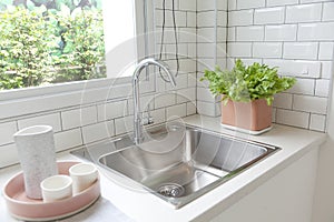 Modern kitchen with white worktop sink