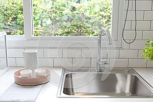 Modern kitchen with white worktop sink