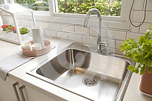 Modern kitchen with white worktop sink