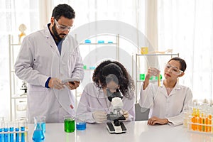 Modern laboratory scientists team conduct experiments