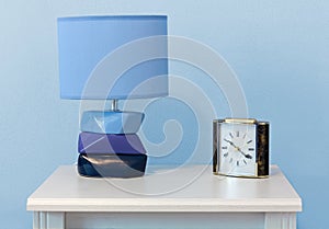 Objects on a White Nightstand