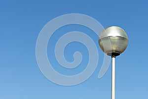 Modern lamppost of gray color and LED lighting installed in urban area