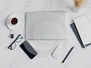 Modern lap top template mock up on white and clean work desk with blank screen Workspace desk, laptop, coffee cup and pen. laptop