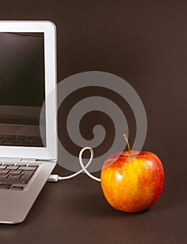 Modern laptop computer on dark background.