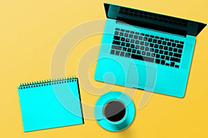 A modern laptop computer   on the turquoise background