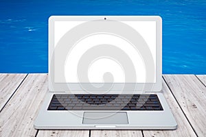 Modern Laptop in front of Ocean. 3d Rendering