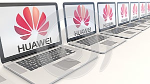 Modern laptops with Huawei logo. Computer technology conceptual editorial 3D rendering