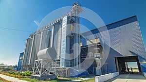 Modern large granary timelapse hyperlapse. Large metal silos. photo