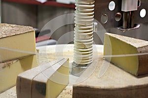 Modern laser tool to cut Comte wheels at cheese shop