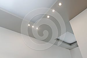 Modern layered ceiling with embedded lights photo