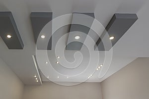 Modern layered ceiling with embedded lights photo