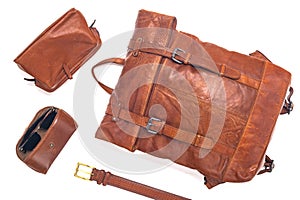 Modern leather backpack and accessories on a white background. Stylish leather accessories close-up. View from above