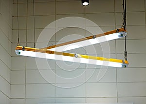 modern LED lighting cross shape at the ceiling