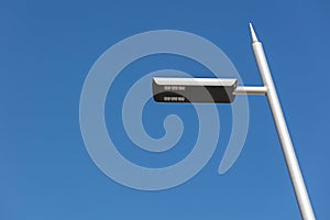 Modern led street lamp on blue sky background