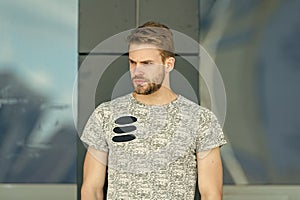 Modern life. macho man glass building background. male fashion summer trends. strong-willed male. unshaven man care skin