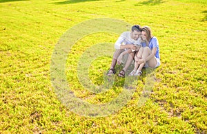 Modern Lifestyle Concept: Caucasian Couple Sitting Embraced Toge