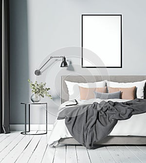 Modern light blue Scandinavian bedroom with blank frame