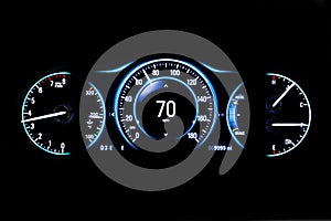 Modern light car mileage on black background 70 mph