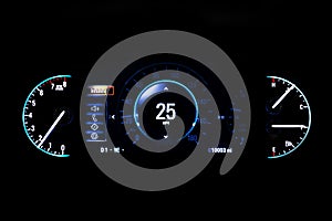 Modern light car mileage on black background Info 25 mph