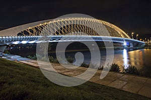 Modern lighted bridge in night
