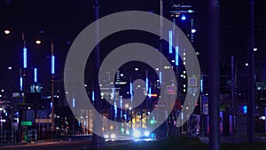Modern lights of city at night on busy highway. Stock footage. City highway is lit with neon lights and headlights of