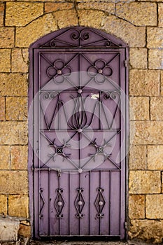 Modern lilac metal door openwork a beautiful vintage background