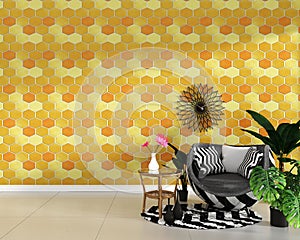 Modern living room interior with armchair decoration and green plants on hexagon yellow and orange tile texture wall background,