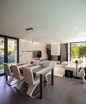 Modern living room overlooking the garden and swimming pool.