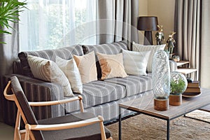 Modern living room with striped pillows on a casual sofa