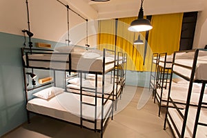 Modern loft with bunk beds in youth hostel with dormitory rooms