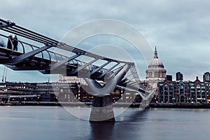 Modern London skyline on River Thames on cloudy gray day