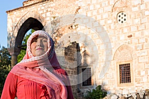 Modern Lookalike Muslim Woman With Scarf and Sunglasses Posing in Front of the Mosque