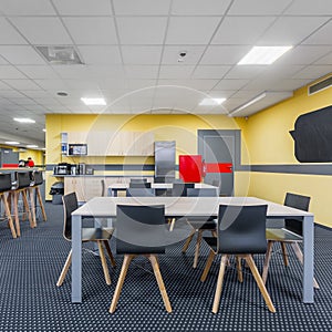 Modern lunchroom interior with kitchenette