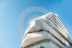 Modern, luxury apartment building against blue sky