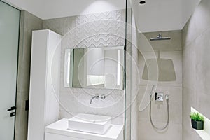 Modern luxury bathroom interior, beautiful minimalistic design with shower, sink and mirrir