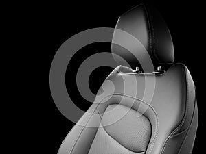 Modern luxury car black leather interior. Part of black leather car seat details with white stitching. Interior of prestige car.