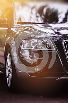 Modern luxury car close-up banner background.