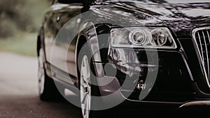 Modern luxury car close-up banner background.